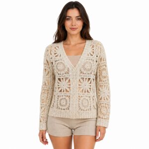 Woman wearing an ivory floral crochet button-down cardigan